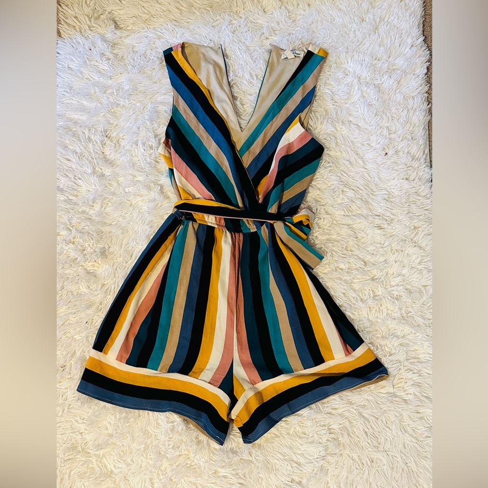 Stripe romper with a waist tie.